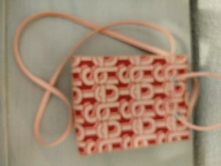 Bolsito Tous estampado rosa y rojo