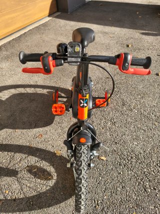 Bicicleta infantil 14" Btwin naranja de iniciación