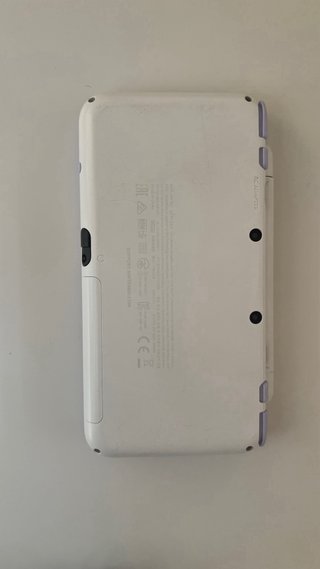 Nintendo 2DS XL con cargador y juegos