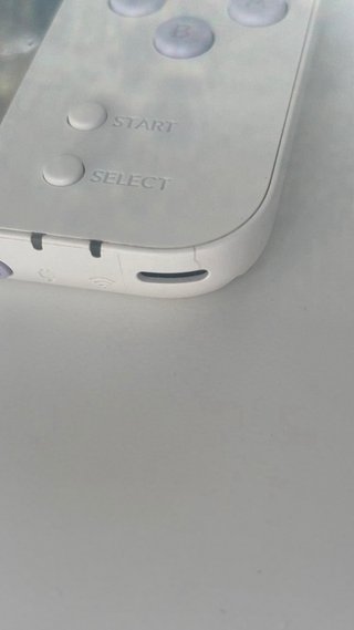 Nintendo 2DS XL con cargador y juegos