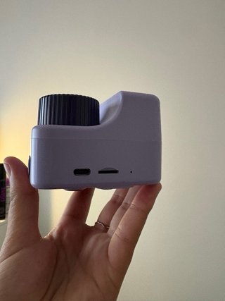 Câmara Instantânea Lilás Nova na Caixa