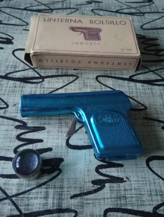 Linterna antigua de bolsillo tipo pistola