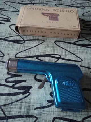 Linterna antigua de bolsillo tipo pistola