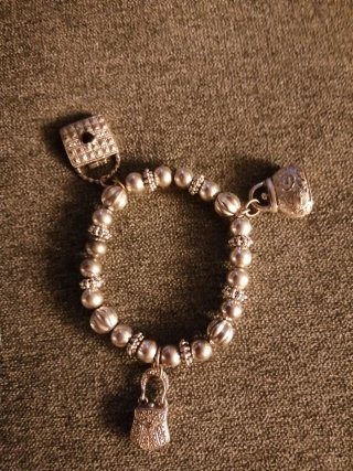 Braccialetto argento con ciondoli borsetta