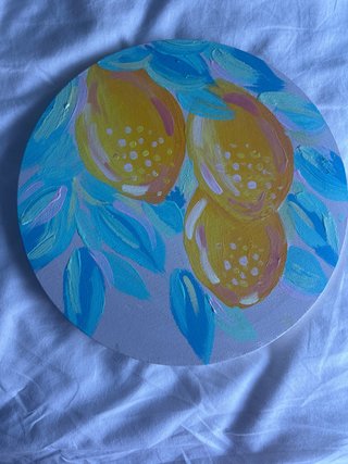 Pintura redonda de limones y hojas