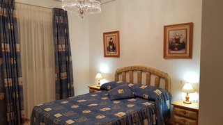 Cortinas y edredón dormitorio