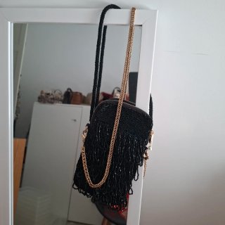 Bolso fiesta UTERQUE negro y dorado