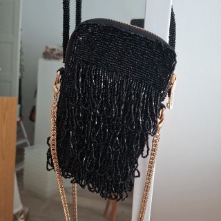 Bolso fiesta UTERQUE negro y dorado