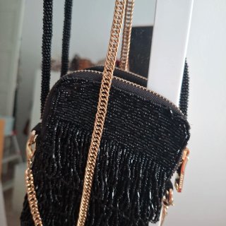 Bolso fiesta UTERQUE negro y dorado