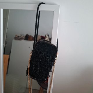 Bolso fiesta UTERQUE negro y dorado