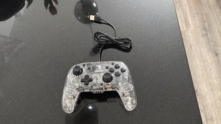 Mando Nintendo Afterglow Transparente