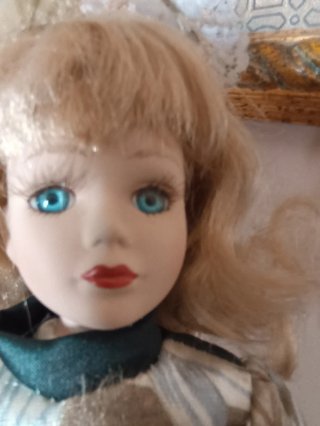 Bambola vintage porcellana occhi blu