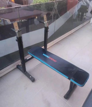 Banco de pesas con barra y discos 20kg