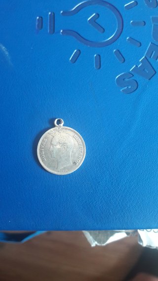 Moneda con colgante