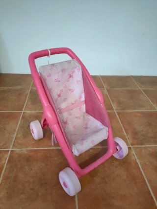 Cochecito andador rosa para muñecas