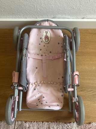 Carro de muñecas rosa y gris