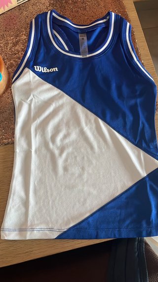 Camiseta deportiva Wilson azul y blanca Xs de niña