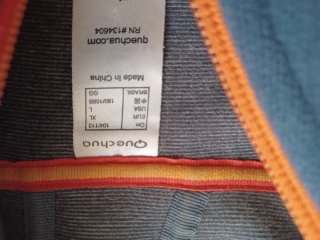 Chaqueta polar Quechua hombre azul y naranja