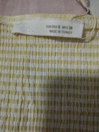 Camiseta amarilla de cuadros sin mangas