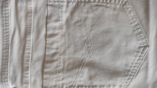 Pantalón corto blanco tachuelas