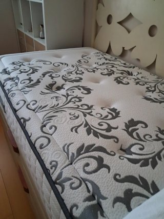 Cama nido con canapé y cabecero de forja.