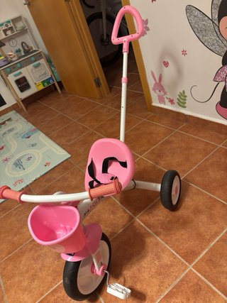Triciclo Chicco rosa con barra de paseo