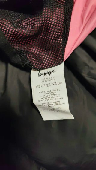 Giubbotto Stussy nero con interno rosa