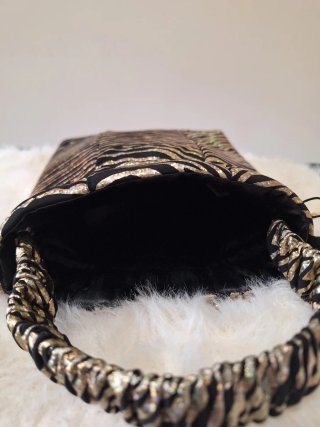 Bolso de fiesta cebra dorado y negro