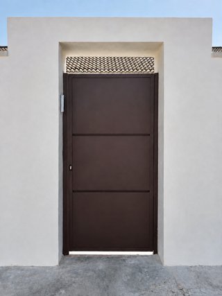 Puerta corredera metálica de paneles lisos
