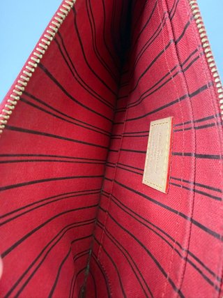 Pochette Louis Vuitton Monogram Marrón y Dorado