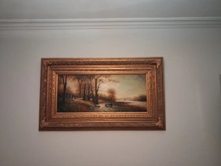 Precioso óleo en tabla de paisaje con marco dorado