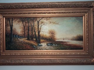 Precioso óleo en tabla de paisaje con marco dorado