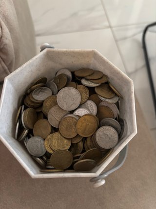 Tarro con pesetas variadas