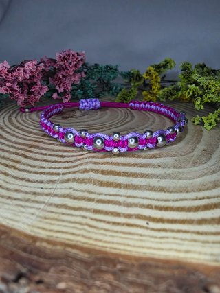 Pulsera hecha a mano fucsia y lila