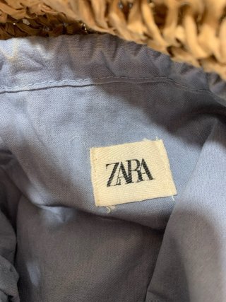 Mochila Zara pompones y conchas