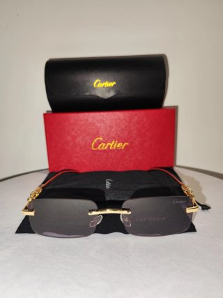 Gafas de sol Cartier doradas y negras