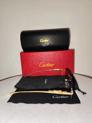 Gafas de sol Cartier doradas y negras
