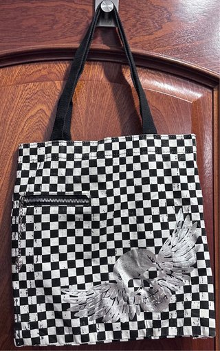 Bolso de tela con calavera y alas