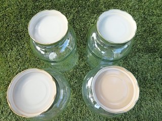 4 botes de cristal con tapa