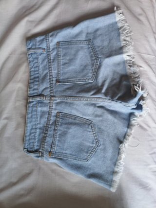 Pantalones cortos vaqueros rotos