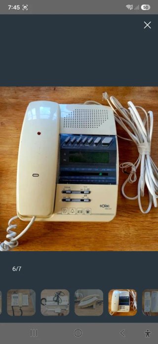 Teléfonos fijos vintage beige y blanco