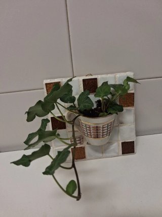 Mosaico artesanal con taza