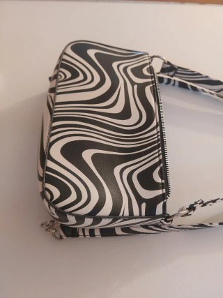 Bolso estampado cebra blanco y negro