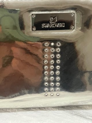 Cartera Swarovski plateada