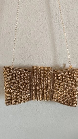Bolso Clutch Dorado con Lazo