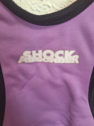 Top deportivo morado y negro. Talla S