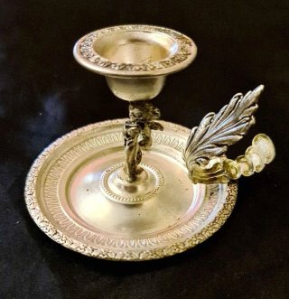 antica Bugia portacandela con putto