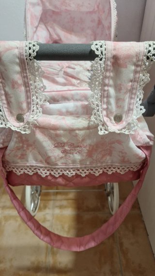Cochecito de bebé de juguete rosa