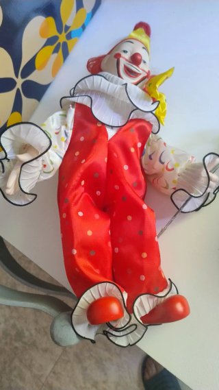 Marioneta de porcelana payaso