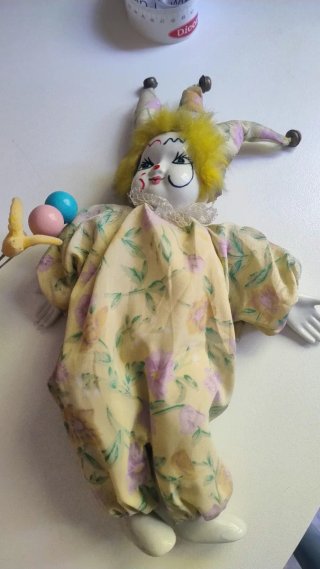 Marioneta de porcelana payaso